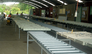 Core trays placed sideways along the roller racking