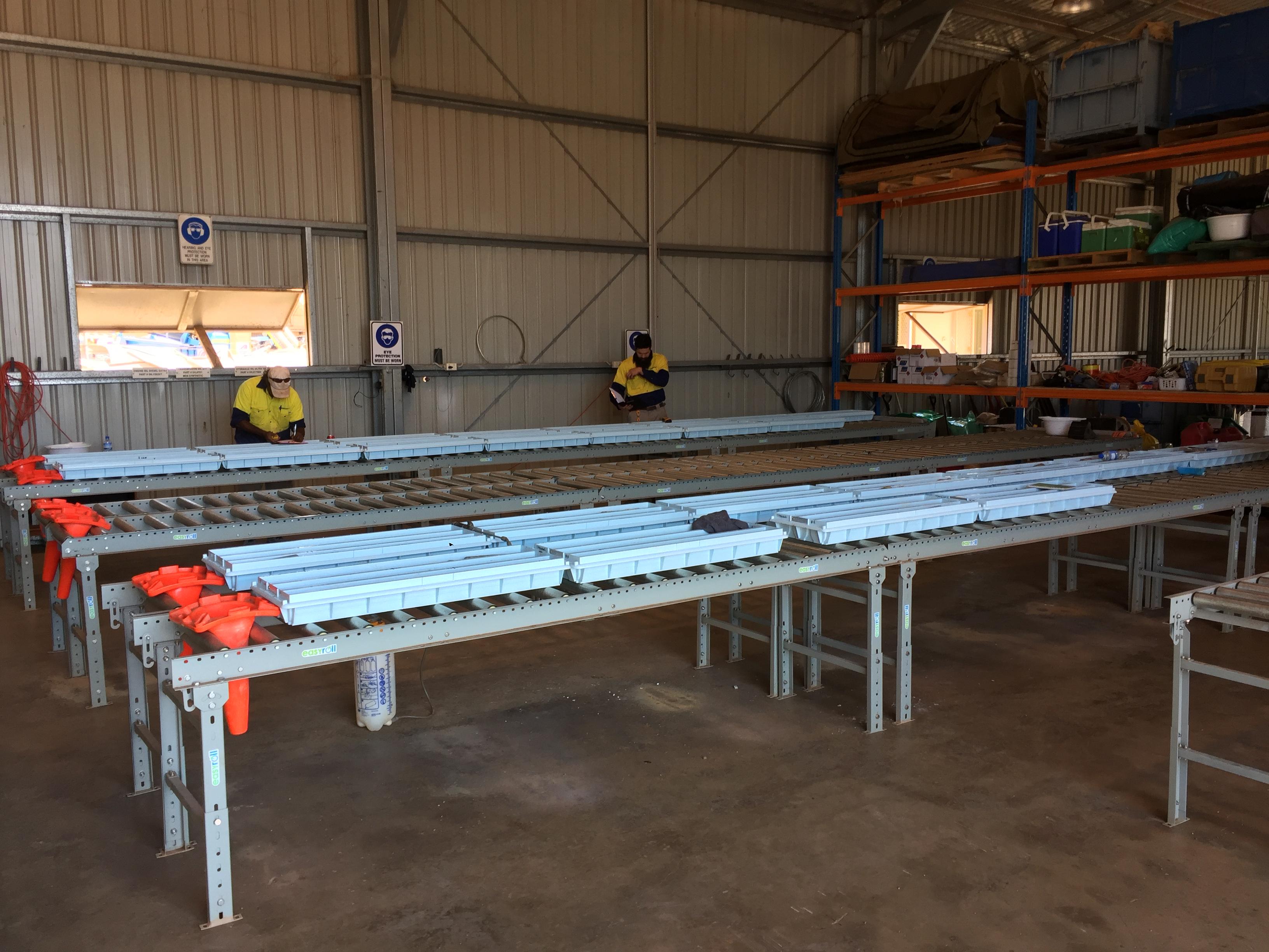 Plastic core trays on a roller rack